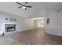 Spacious living room with vaulted ceilings, stone fireplace, wood-look floors and lots of natural light at 232 Barrett Springs Way, Canton, GA 30115