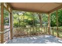 View from the screened porch surrounded by a lush, green yard at 433 Pine Dr, Pine Lake, GA 30072