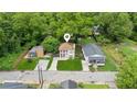 Aerial view of the home with mature trees and a well-maintained lawn at 1001 Dunning Se St, Atlanta, GA 30315
