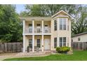 Charming two-story home featuring a welcoming front porch and balcony at 1001 Dunning Se St, Atlanta, GA 30315