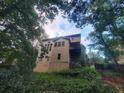 Back of home showing upper level deck at 1033 Hawk Creek Trl, Lawrenceville, GA 30043