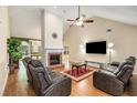Spacious living room featuring a fireplace, high ceilings, and comfortable seating at 115 Pinnacle Ln, Mcdonough, GA 30253