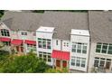 Modern townhome exterior featuring a red awning, large windows, and well-maintained facade at 1344 Fernwood Ne Cir, Brookhaven, GA 30319