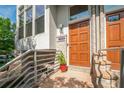 Inviting front entrance with a wooden door, brick accents, and modern railings leading to the entrance at 1344 Fernwood Ne Cir, Brookhaven, GA 30319