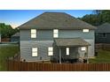 The home features a fenced backyard and covered patio, perfect for outdoor entertaining at 255 Webster Lake Dr, Temple, GA 30179