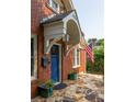 The brick home has a covered front entry with a charming stone tile porch at 608 Hardendorf Ne Ave, Atlanta, GA 30307