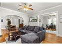 Open living space with hardwood floors, comfortable sectional couch, and access to dining and office at 608 Hardendorf Ne Ave, Atlanta, GA 30307