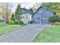 Two-car garage and driveway, showcasing the home's well-kept lawn and convenient parking at 907 Eden Se Ave, Atlanta, GA 30316