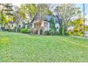 Well-maintained home with a spacious green lawn and mature trees, located on a desirable street at 907 Eden Se Ave, Atlanta, GA 30316
