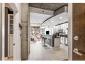Modern open-concept kitchen with stainless steel appliances and bar seating at 855 Peachtree Ne St # 2309, Atlanta, GA 30308