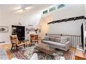 Spacious living room boasts vaulted ceilings, skylights, and a decorative wooden beam accent at 2960 Cedar Knoll Dr, Roswell, GA 30076