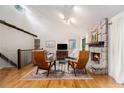 Cozy living room with a stone fireplace, comfortable seating, and hardwood flooring throughout at 2960 Cedar Knoll Dr, Roswell, GA 30076