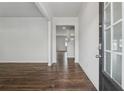 Bright entryway with dark hardwood floors, white walls, and a view of the staircase to the upper level at 96 Quail Bend Way, Dallas, GA 30157