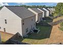 A series of backyards with simple patio dining sets are seen in this residential neighborhood at 1152 Werre Way, Locust Grove, GA 30248
