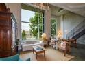 Spacious living room showcasing a large window, concrete ceiling, and cozy seating, accented with unique decor at 850 Ralph Mcgill Ne Blvd # 6, Atlanta, GA 30306