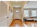 Inviting foyer with hardwood floors leads to a bright living area with lots of natural light at 1744 Chateau Dr, Dunwoody, GA 30338