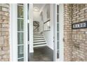 View of the entryway with sleek hardwood floors and an elegant staircase at 3130 Woodwalk Se Trce # 8, Atlanta, GA 30339