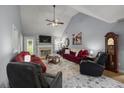 Spacious living room features vaulted ceilings, fireplace, and comfortable seating at 107 Hearthstone Walk, Woodstock, GA 30189