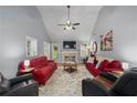 Bright living room with vaulted ceilings, fireplace, and ample seating arrangement at 107 Hearthstone Walk, Woodstock, GA 30189