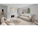 Bright living room with a decorative fireplace, built-in shelving, and a large window overlooking the yard at 3074 Vinings Ridge Se Dr, Atlanta, GA 30339