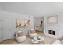 Living room featuring a fireplace, neutral color palette, and cozy seating arrangement at 3074 Vinings Ridge Se Dr, Atlanta, GA 30339