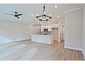 Bright, open-concept living space featuring sleek floors, modern lighting, and a stylish kitchen island, great for entertaining at 174 Bluffington Way, Marietta, GA 30066