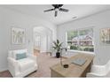 Bright home office featuring a large window, desk, and comfortable seating area at 1955 Pius Dr, Ellenwood, GA 30294