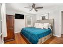 Cozy bedroom with hardwood floors, a ceiling fan, and lots of natural light at 286 Indian Trl, Marietta, GA 30068