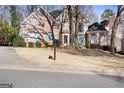 Beautiful brick home with a manicured lawn, traditional architectural details, and a charming curb appeal at 365 Falling Creek Bnd, Duluth, GA 30097