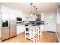 Bright kitchen with stainless steel appliances, white cabinets, and a center island at 3829 Bright Star Road Rd, Douglasville, GA 30135