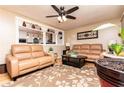 Inviting living room with a ceiling fan, hardwood floors, and tan sofas at 3829 Bright Star Road Rd, Douglasville, GA 30135