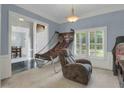 Bonus room with a basketball game and an arcade game, and a neutral chair at 718 First Cotton Dr, Powder Springs, GA 30127