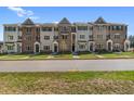 Row of new townhomes with brick and stone facades offers modern living and attractive curb appeal at 1956 Deco Dr, Kennesaw, GA 30144