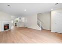 Bright living room boasts a fireplace, hardwood floors, and an open concept design at 6554 Arbor Gate Sw Dr # 4, Mableton, GA 30126