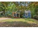 Charming blue home featuring a cozy front porch and classic design at 1592 Braeburn Se Dr, Atlanta, GA 30316