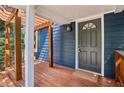 Close up of the front door and a wooden deck with wooden beams at 1592 Braeburn Se Dr, Atlanta, GA 30316