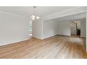 Spacious living room featuring hardwood floors, an open floor plan, and large windows at 2868 Wood Park Nw Trce, Kennesaw, GA 30152