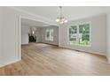 Spacious living room featuring hardwood floors, an open floor plan, and large windows at 2868 Wood Park Nw Trce, Kennesaw, GA 30152