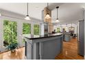 Modern kitchen with granite countertops, stainless steel appliances, and a wine cooler at 130 Timber Oak Cv, Lawrenceville, GA 30043