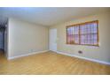 Bright living room with natural light, featuring hardwood floors and neutral-colored walls at 2066 Tidwell Trl, Stone Mountain, GA 30088