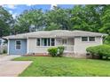 Beautiful one-story home with a freshly painted exterior, manicured bushes, and a well-kept lawn at 2756 Gresham Se Rd, Atlanta, GA 30316