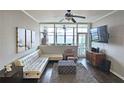 Cozy living room featuring large windows and a comfortable seating arrangement at 3060 Pharr Court North Nw # 719, Atlanta, GA 30305
