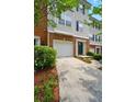Charming townhouse with brick and siding exterior, front yard, and attached garage at 760 Celeste Sw Ln, Atlanta, GA 30331