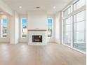Bright living room with fireplace, hardwood floors, and large windows at 260 Guild Ln, Fayetteville, GA 30214