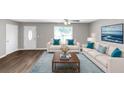 Staged living room with stylish furniture and decor, offering a cozy and inviting atmosphere at 409 Ivy Terrace Dr, Dallas, GA 30157