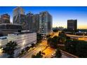 The building set against a vibrant urban skyline at 215 Piedmont Ne Ave # 1001, Atlanta, GA 30308
