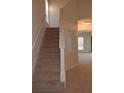 Bright stairway with neutral carpet leads to the upper level in this well maintained home at 2955 Briaroak Dr, Duluth, GA 30096