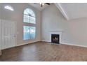 Inviting living room features a fireplace, large window, and a ceiling fan at 4879 Ardsley Dr, Lithonia, GA 30038