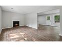 Open-concept living room with fireplace and hardwood floors at 3919 Valley Brook Rd, Snellville, GA 30039