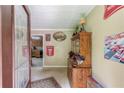 View of the entryway leading into the kitchen with a wood-stained hutch at 1148 Woodland Cir, Lawrenceville, GA 30043
